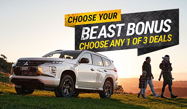 A white SUV parked on a hill with 'Beast Pack' graphics in the background