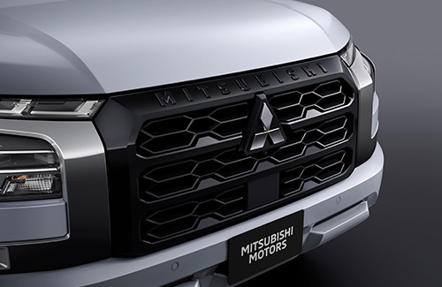 Triton front grille with black lettering